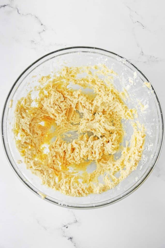 glass mixing bowl with cream butter.