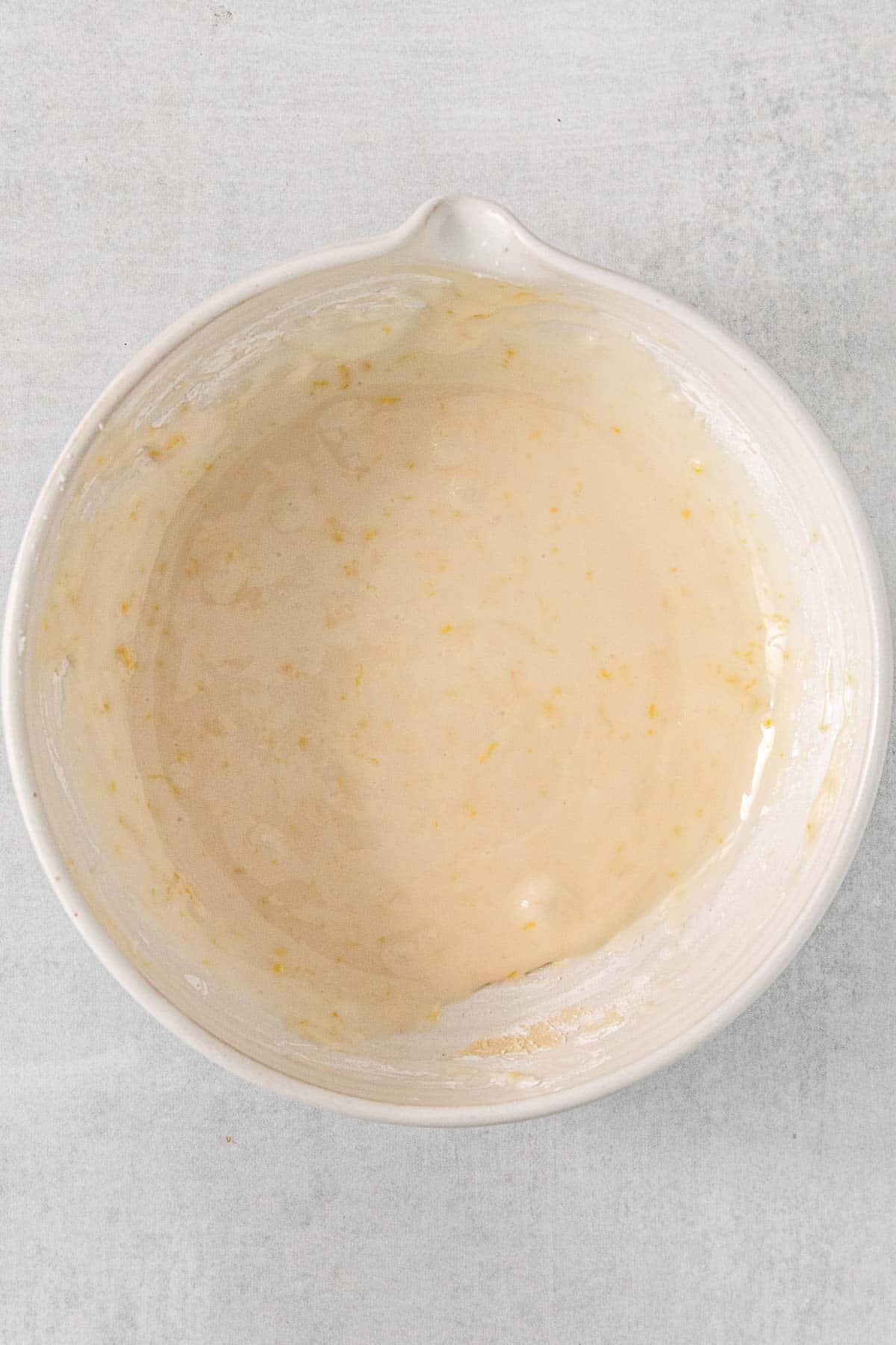 White mixing bowl with lemon glaze.