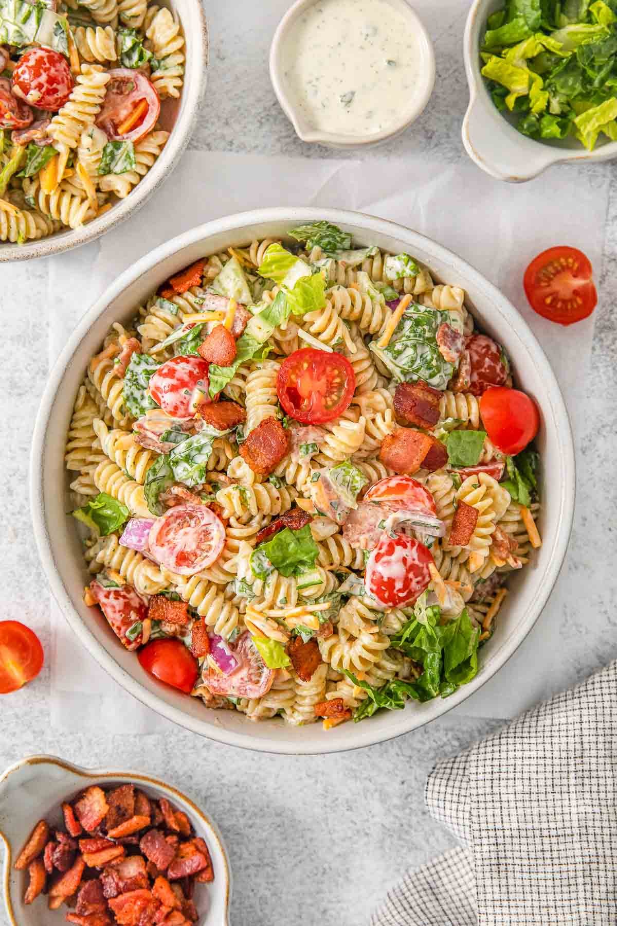 BLT pasta salad in a white bowl.