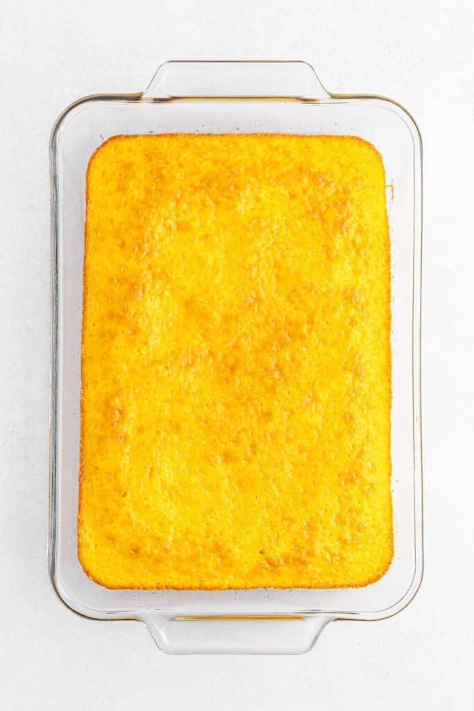 Baked lemon cake in a rectangle baking pan.