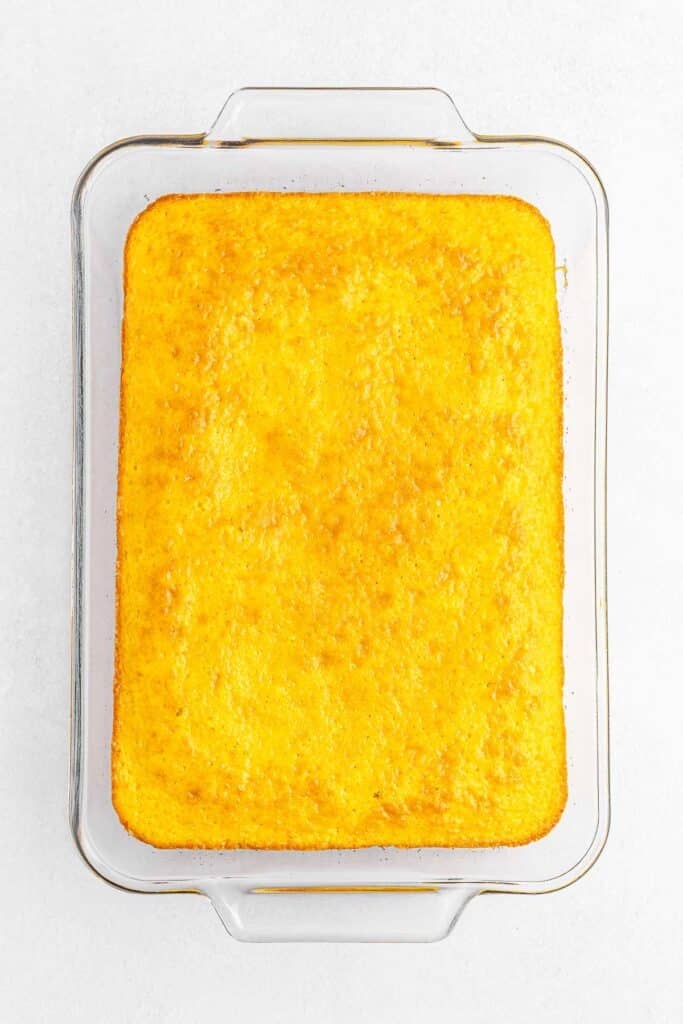 Baked lemon cake in a rectangle baking pan.