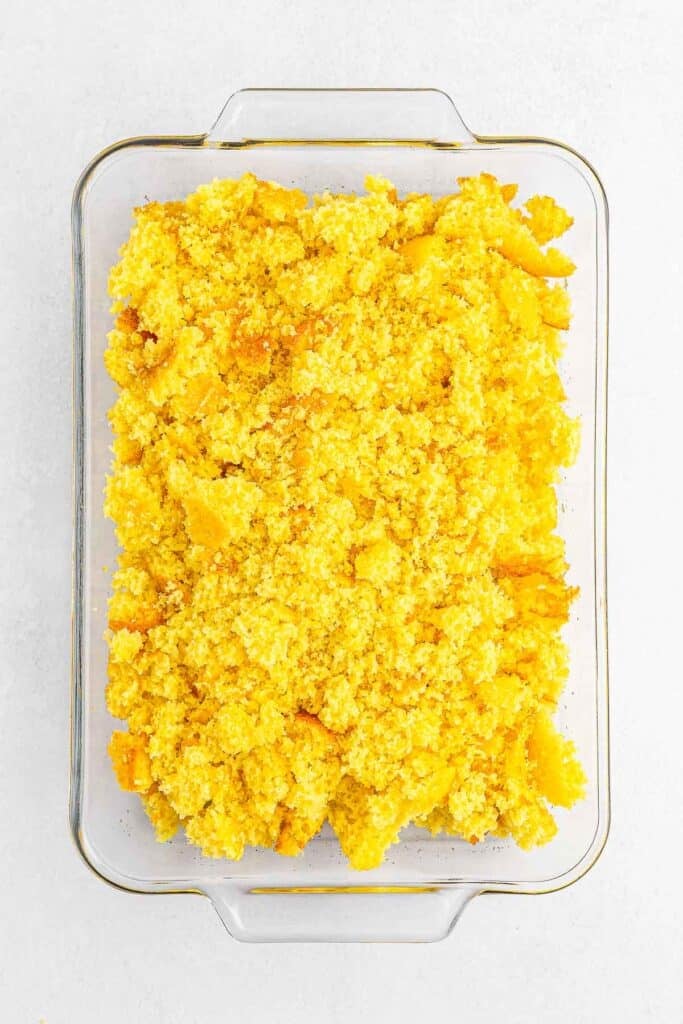 Lemon cake crumbled in a rectangle baking dish.