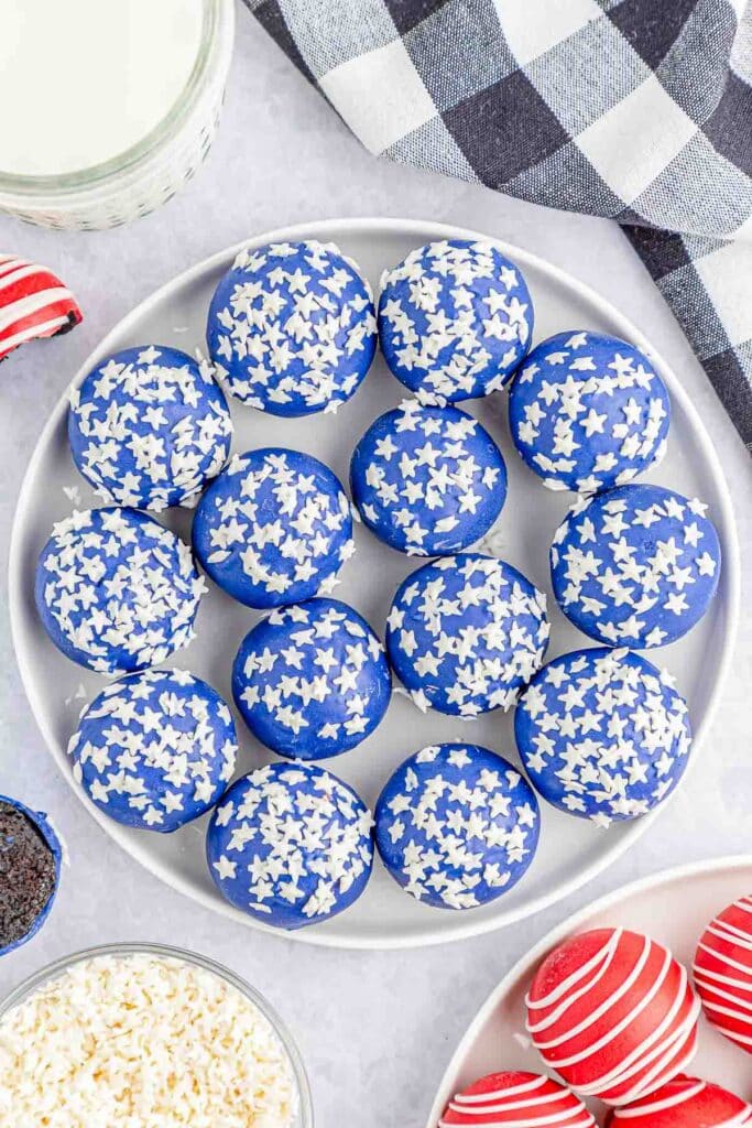 Large white plate of blue oreo balls.