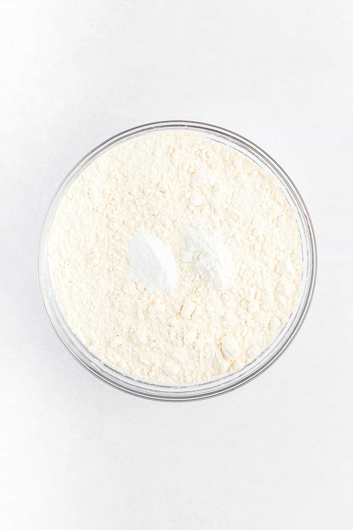 glass mixing bowl with flour.