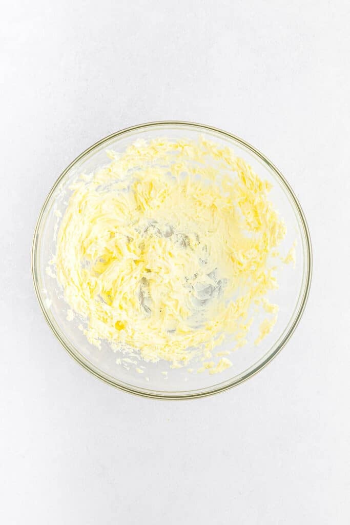 glass mixing bowl with beat butter.