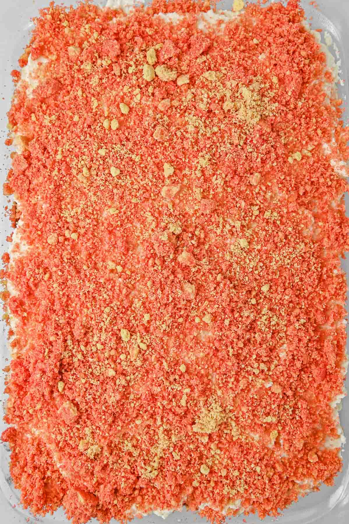 Crumb topping spread over cake mix in cake pan.