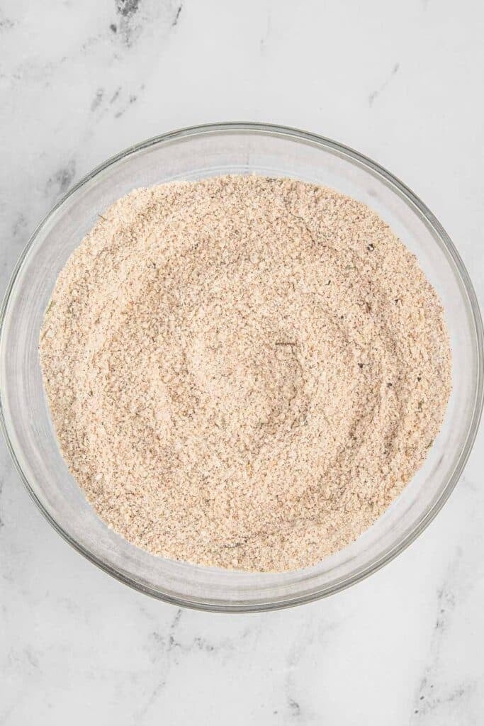Large glass bowl of breadcrumbs.