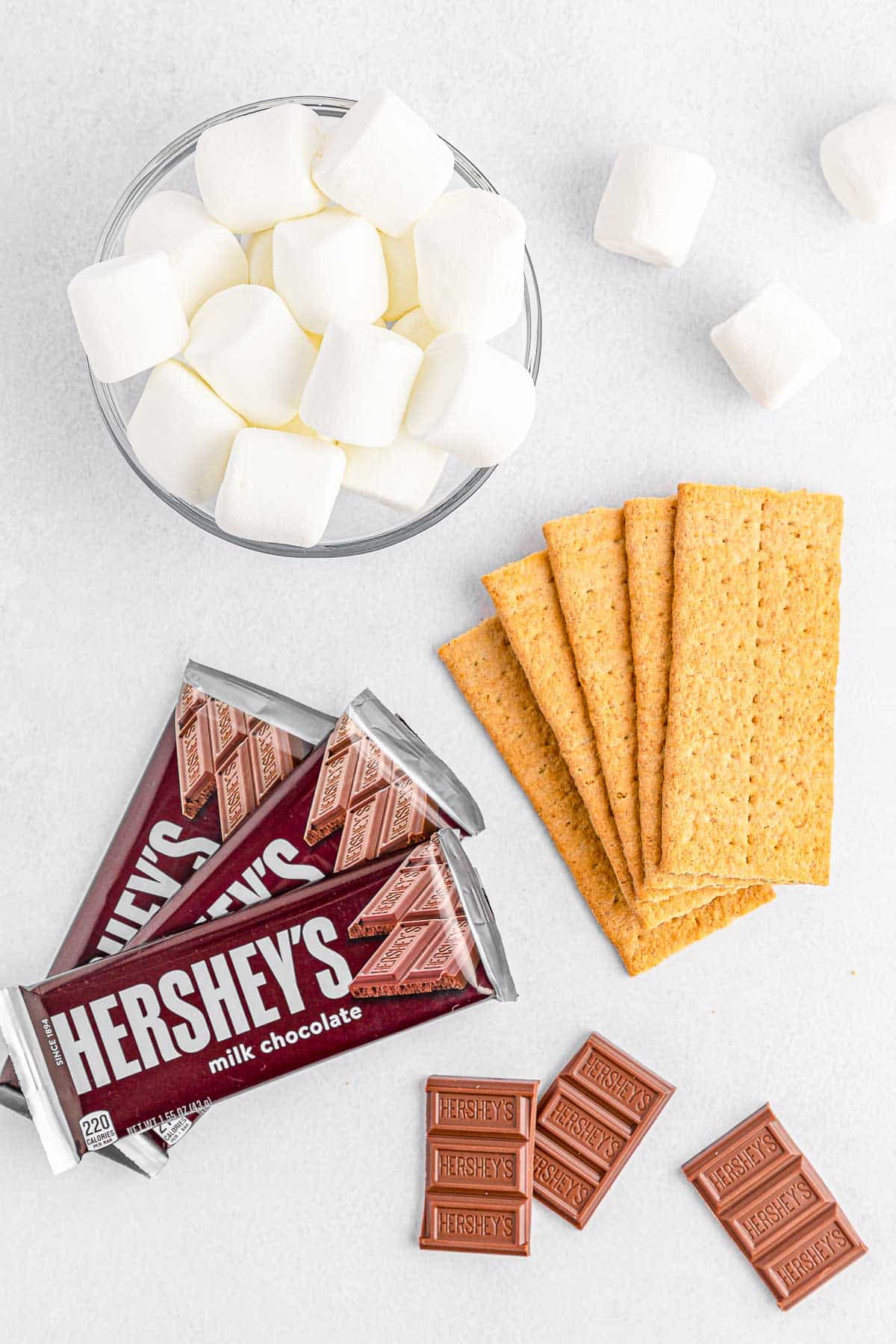 ingredients for air fryer s'mores - Marshmallows, chocolate bar, graham crackers.