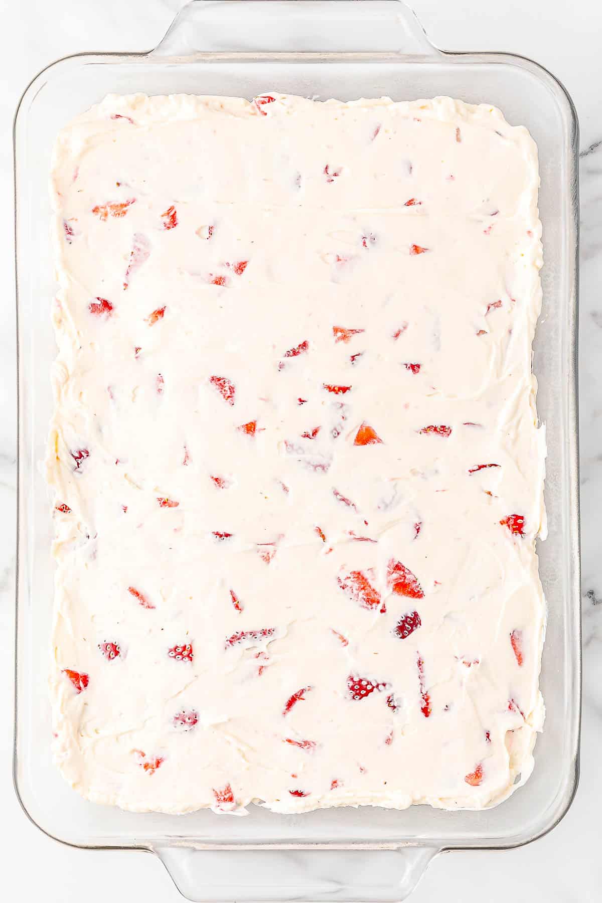 Strawberry delight in baking dish without topping.