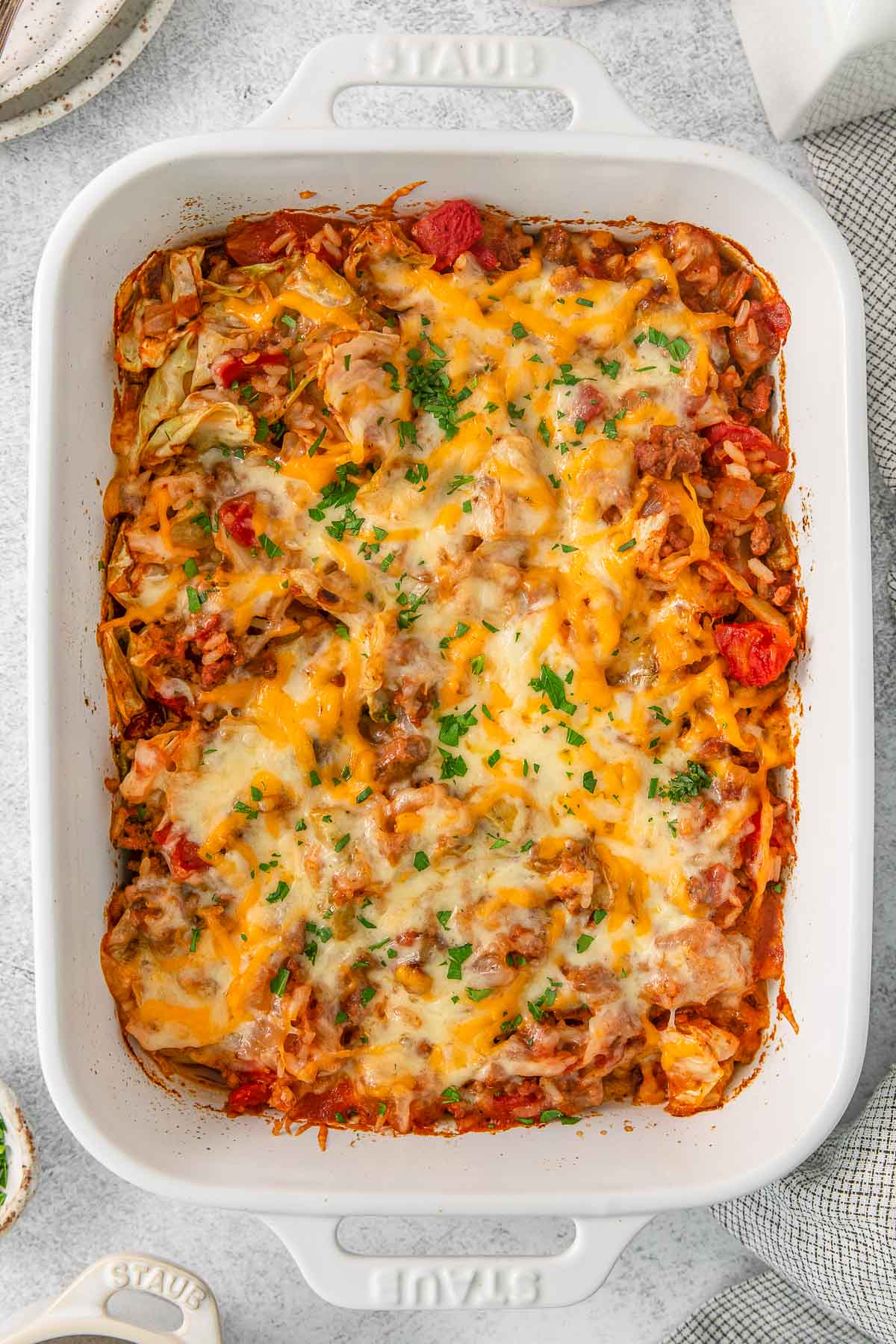 Cabbage roll casserole in a white baking dish.