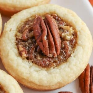 Pecan pie cookies on a white plate.