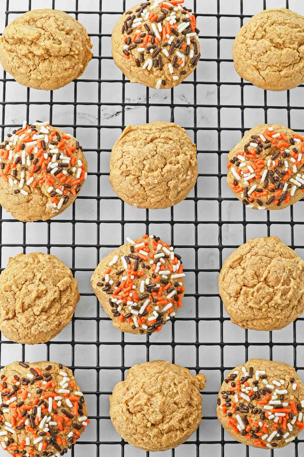 Pumpkin spice cookies on a cooling rack.