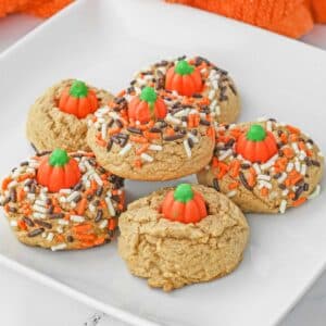 Multiple Pumpkin Spice Cookies on a white plate.