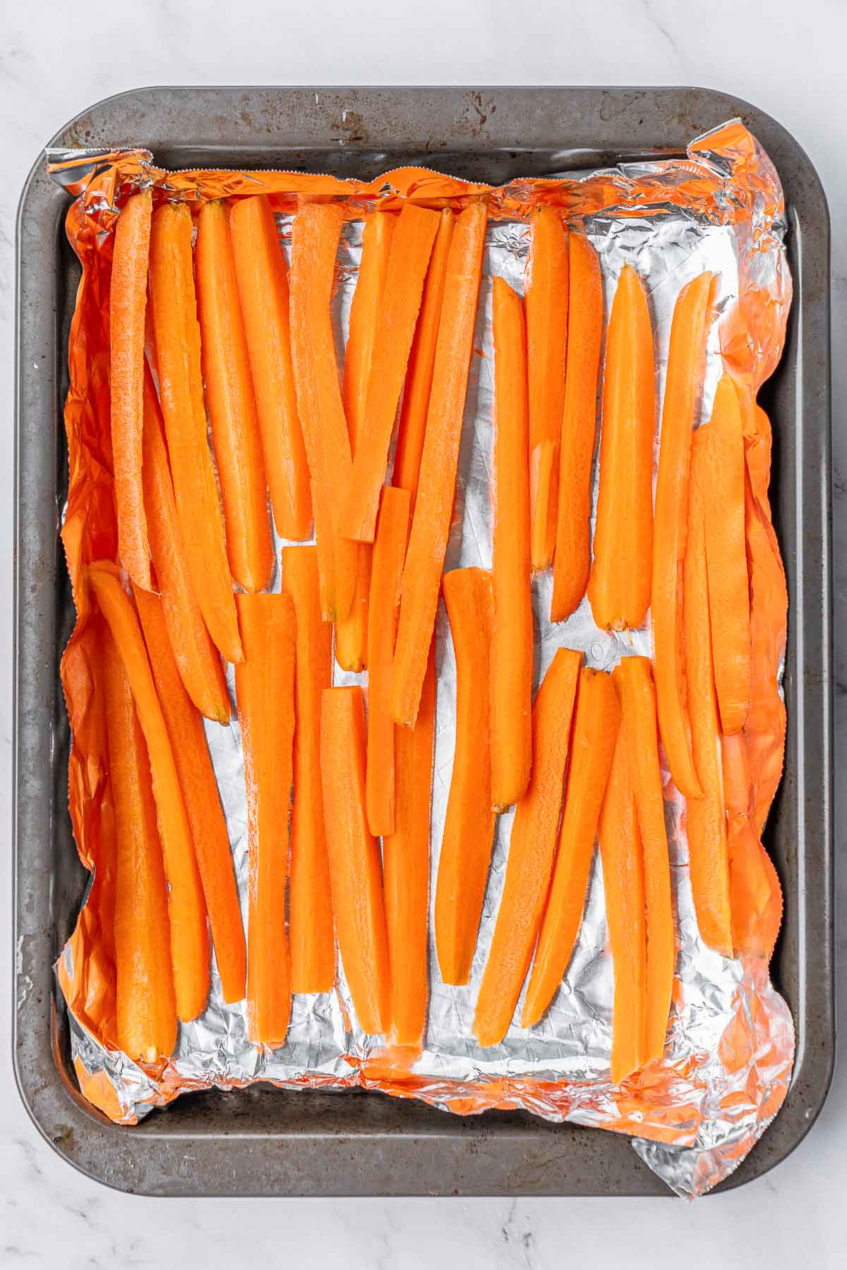Carrot slices on a baking sheet.