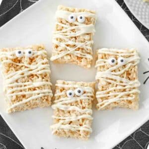 Mummy rice krispy treats on a plate.