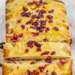 Casy cranberry bread recipe drizzled with orange glaze.