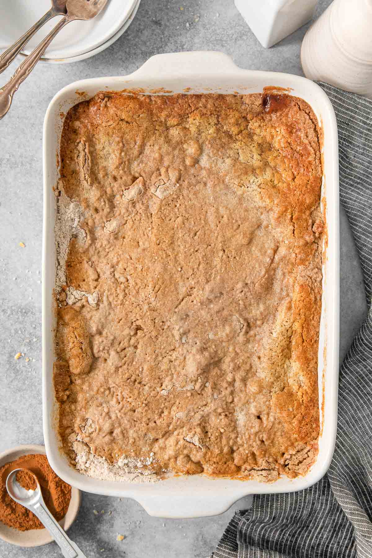 A rectangle baking dish with an apple dump cake baked in it.