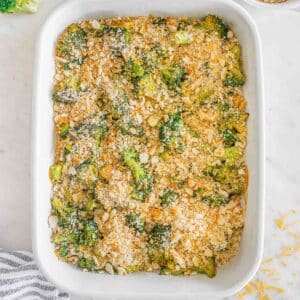 Broccoli casserole in a white baking dish.