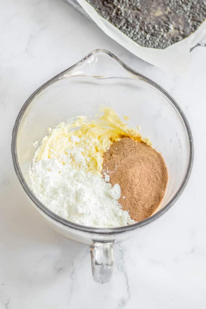 Ingredients for a chocolate delight layer in a glass bowl.