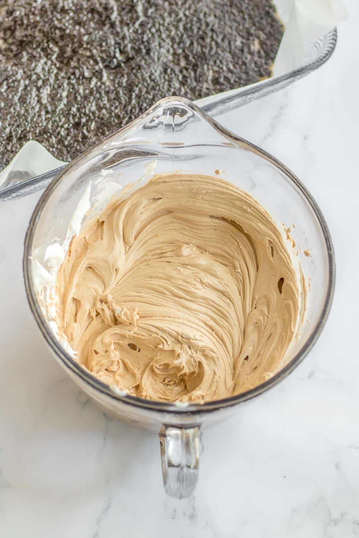 glass mixing bowl with chocolate cream cheese mixture.