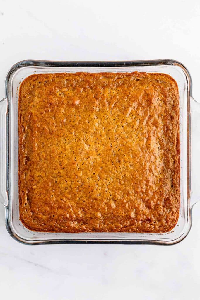 Gingerbread cake baked in a large glass mixing bowl.