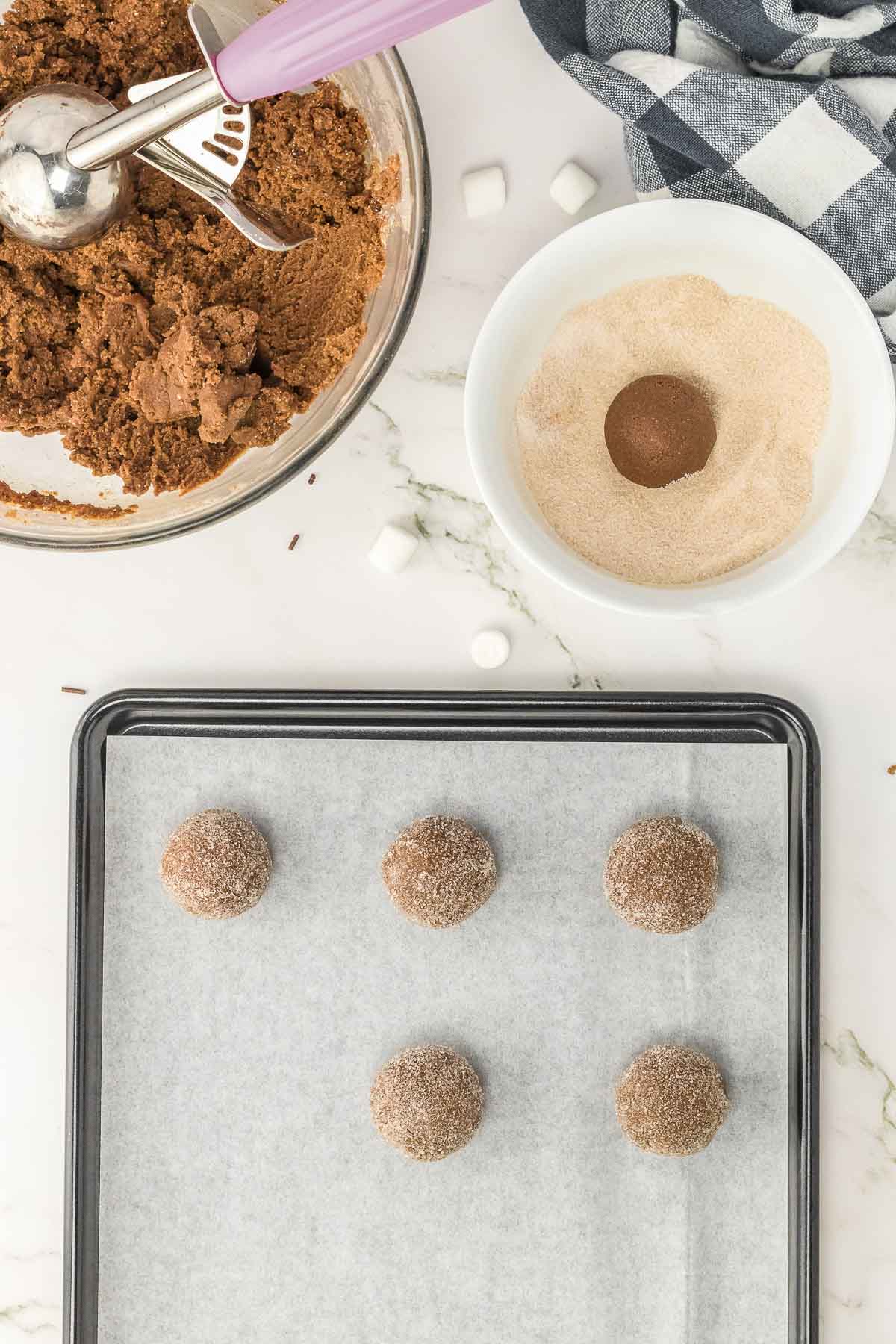 Dough rolled into 1 inch balls placed on a baking sheet.