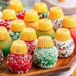 A tray of Christmas oreo balls with different colored holiday sprinkles.