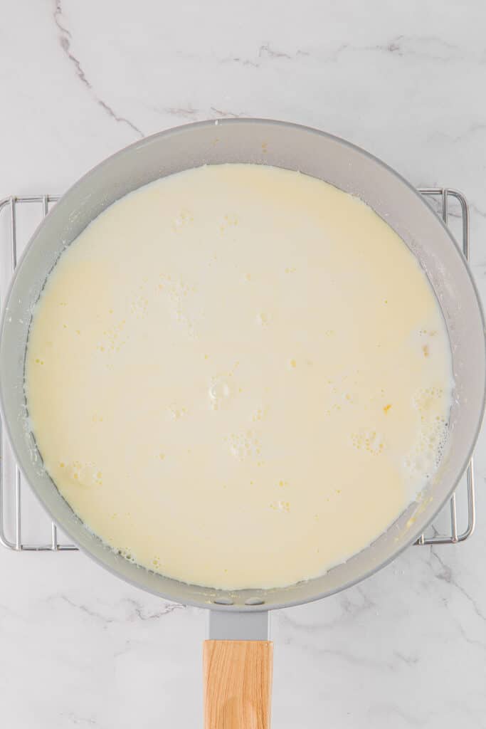 Cheese sauce in a large pan.