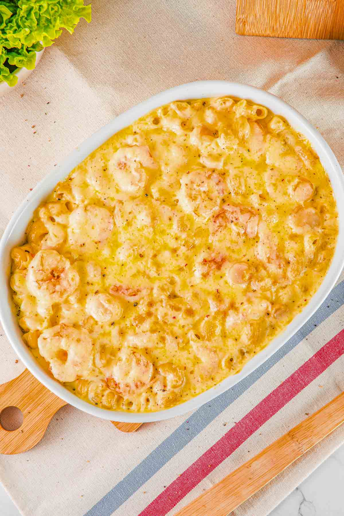 A white dish of seafood mac and cheese.