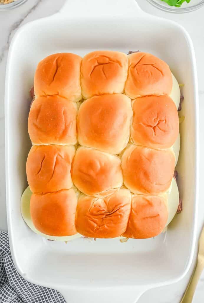 Sliders in a white baking dish.