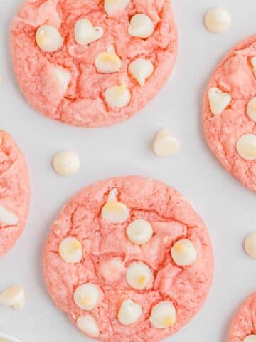 Strawberry cookies with white chocolate chips spread throughout.