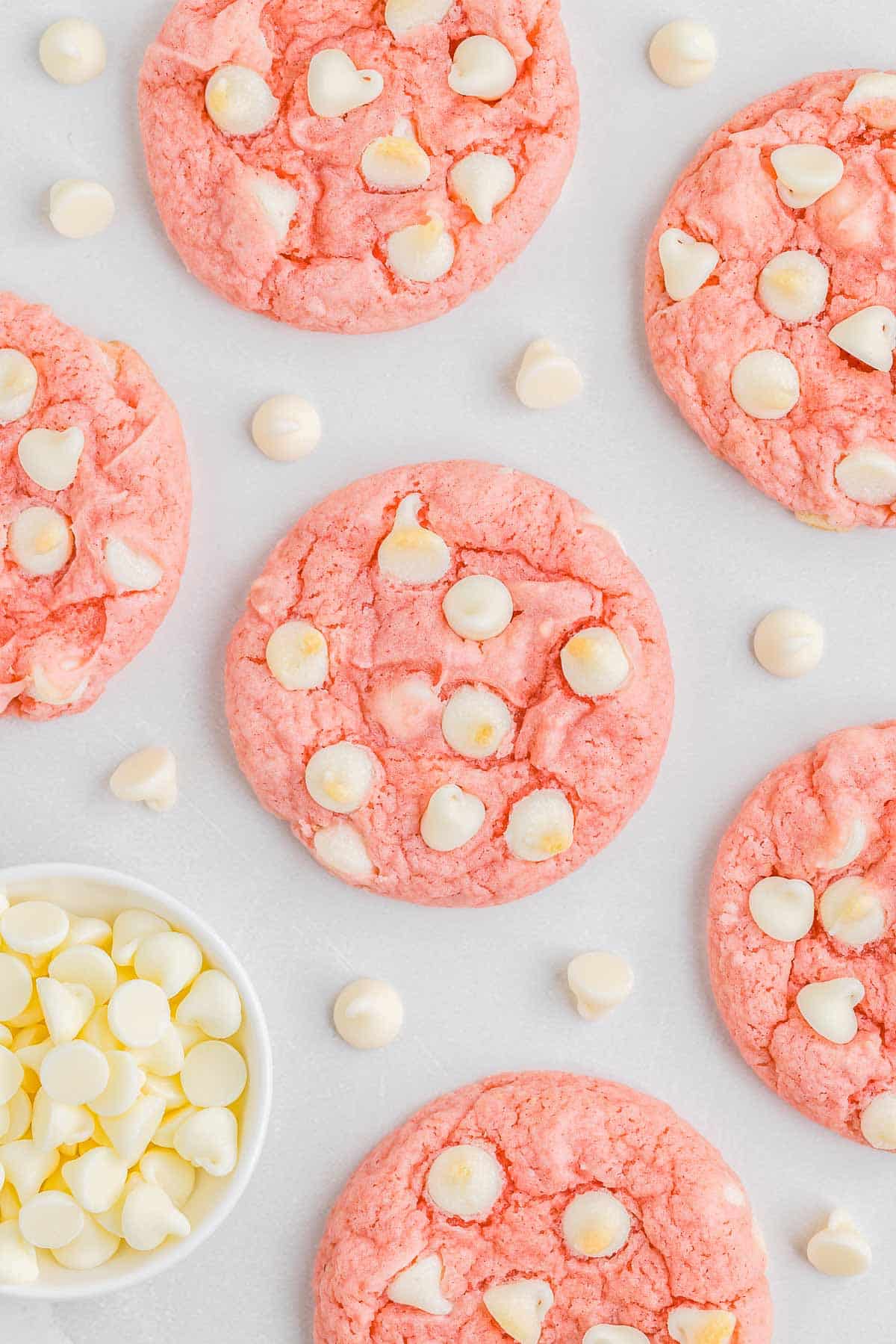 Strawberry cookies with white chocolate chips spread throughout.