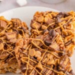 A stack of peanut butter rice krispie treats on a white plate.