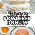 A stack of four powdered sugar donuts with a bite taken out of the top donut.